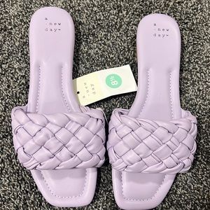 Women’s size 8.5 violet slip on sandals. NWT